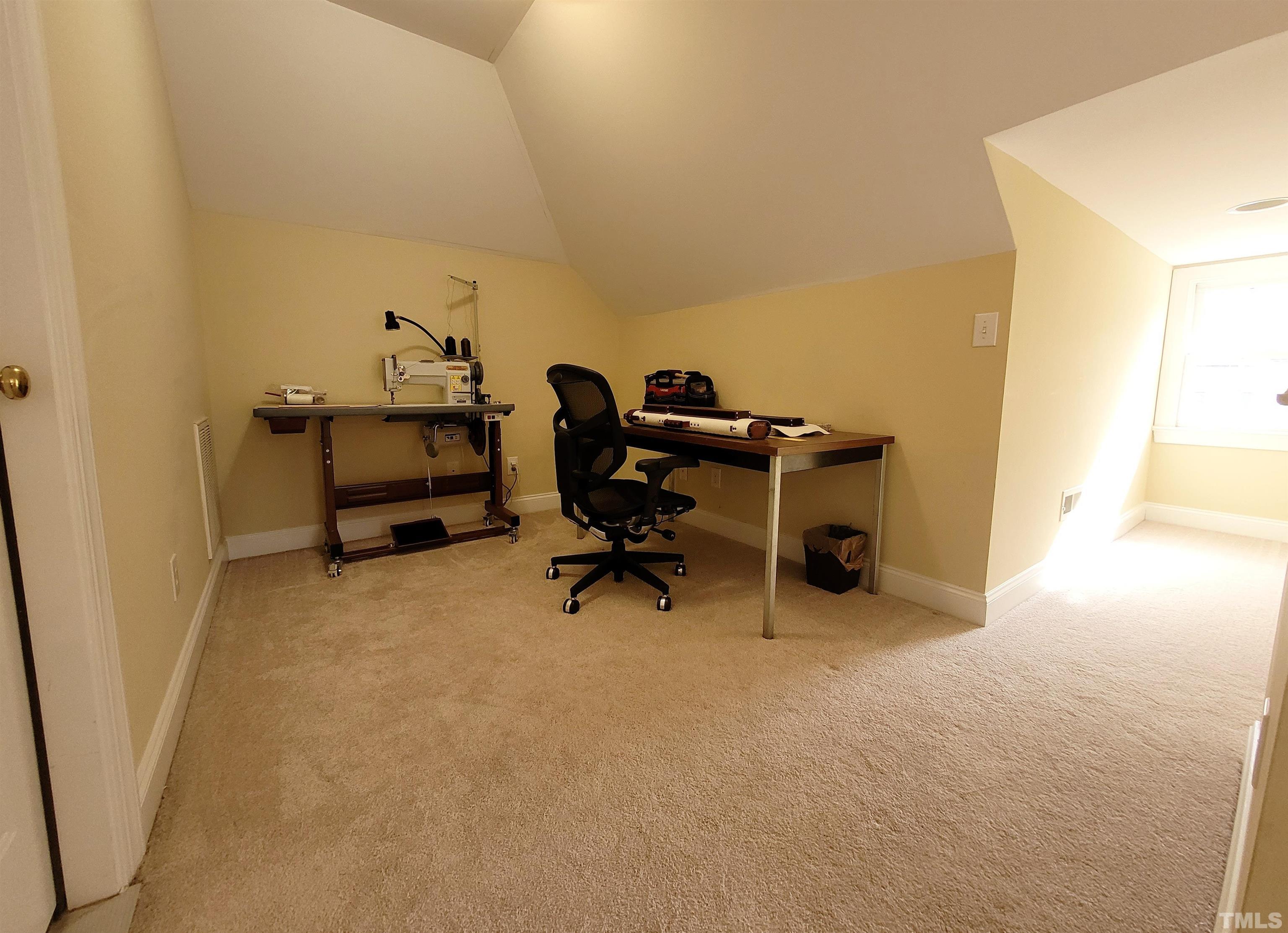 411 Magdala Place Apex, NC 27502 - Photo 8 of 29 a view of a workspace with furniture