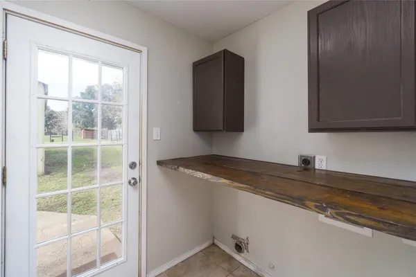 a kitchen with a sink and a mirror