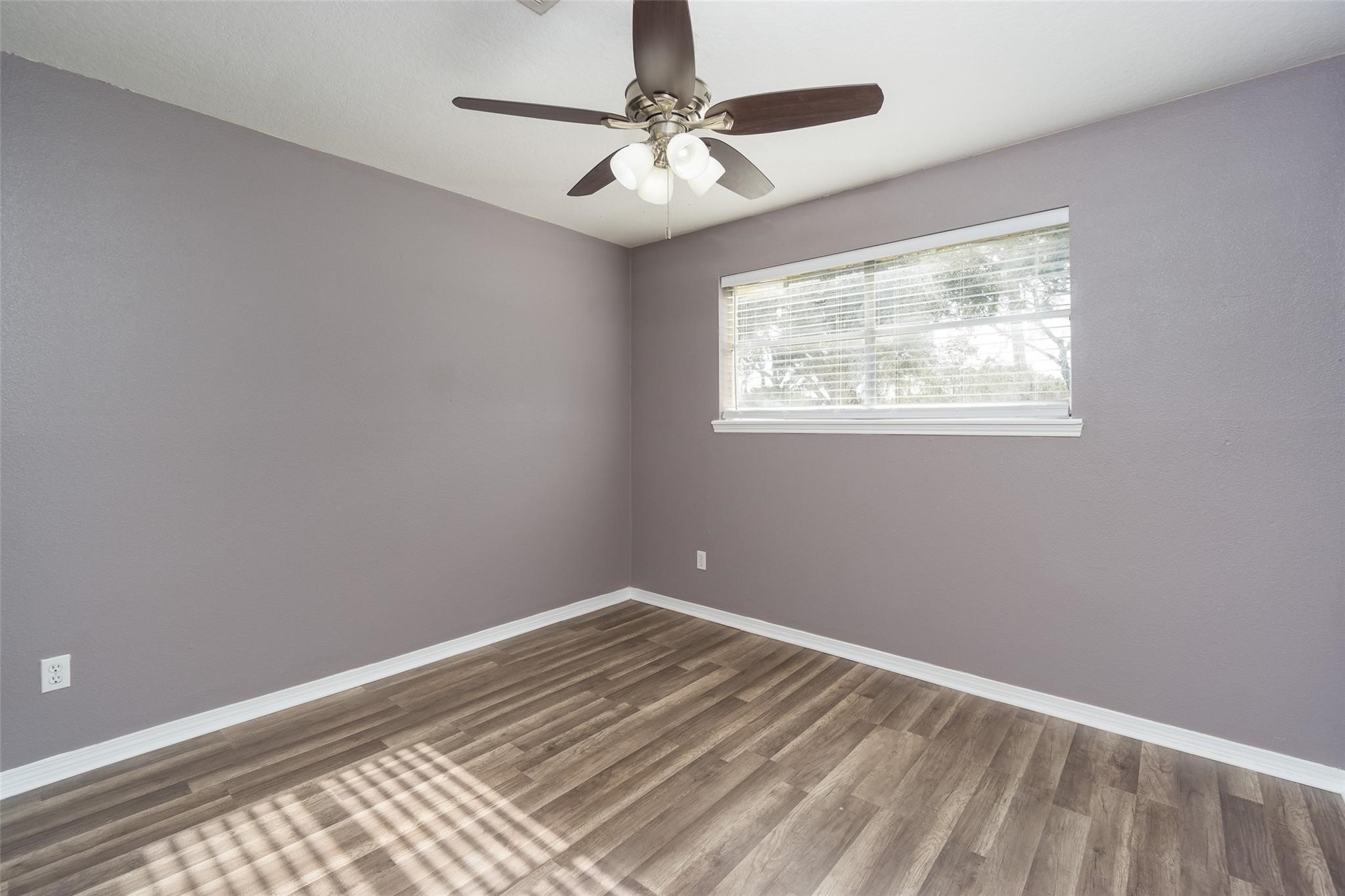 4604 South Tower Road Santa Fe, TX 77517 - Photo 16 of 28 a view of a room with a ceiling fan and a window