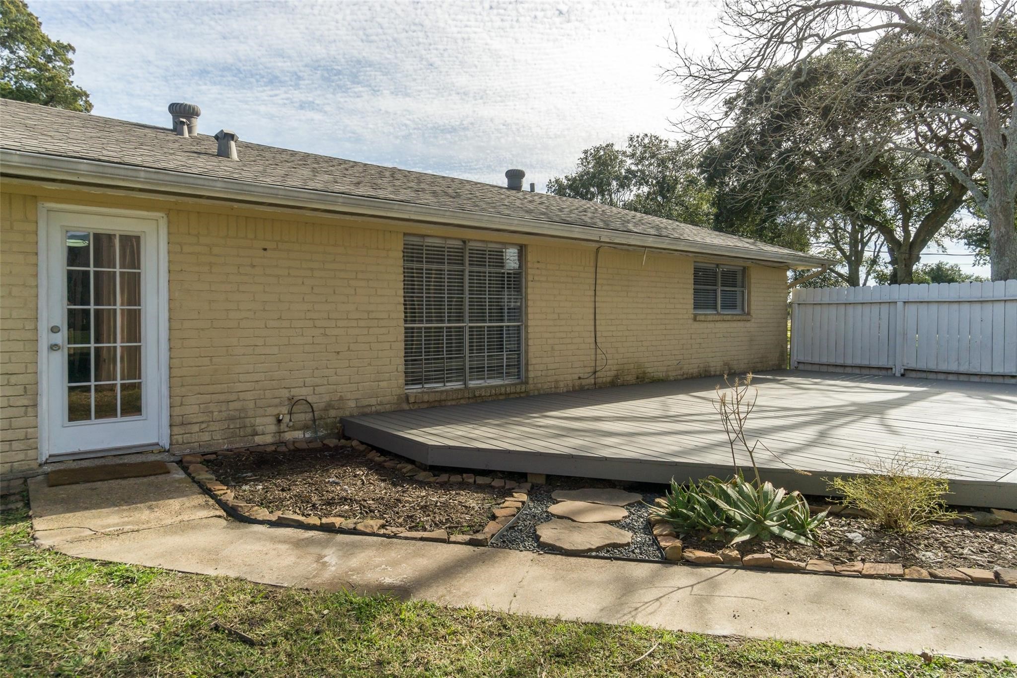 4604 South Tower Road Santa Fe, TX 77517 - Photo 21 of 28 a view of a house with a backyard
