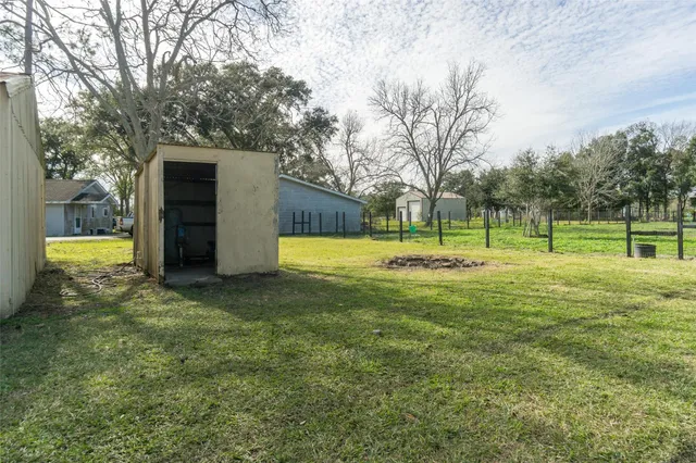 a view of backyard with green space