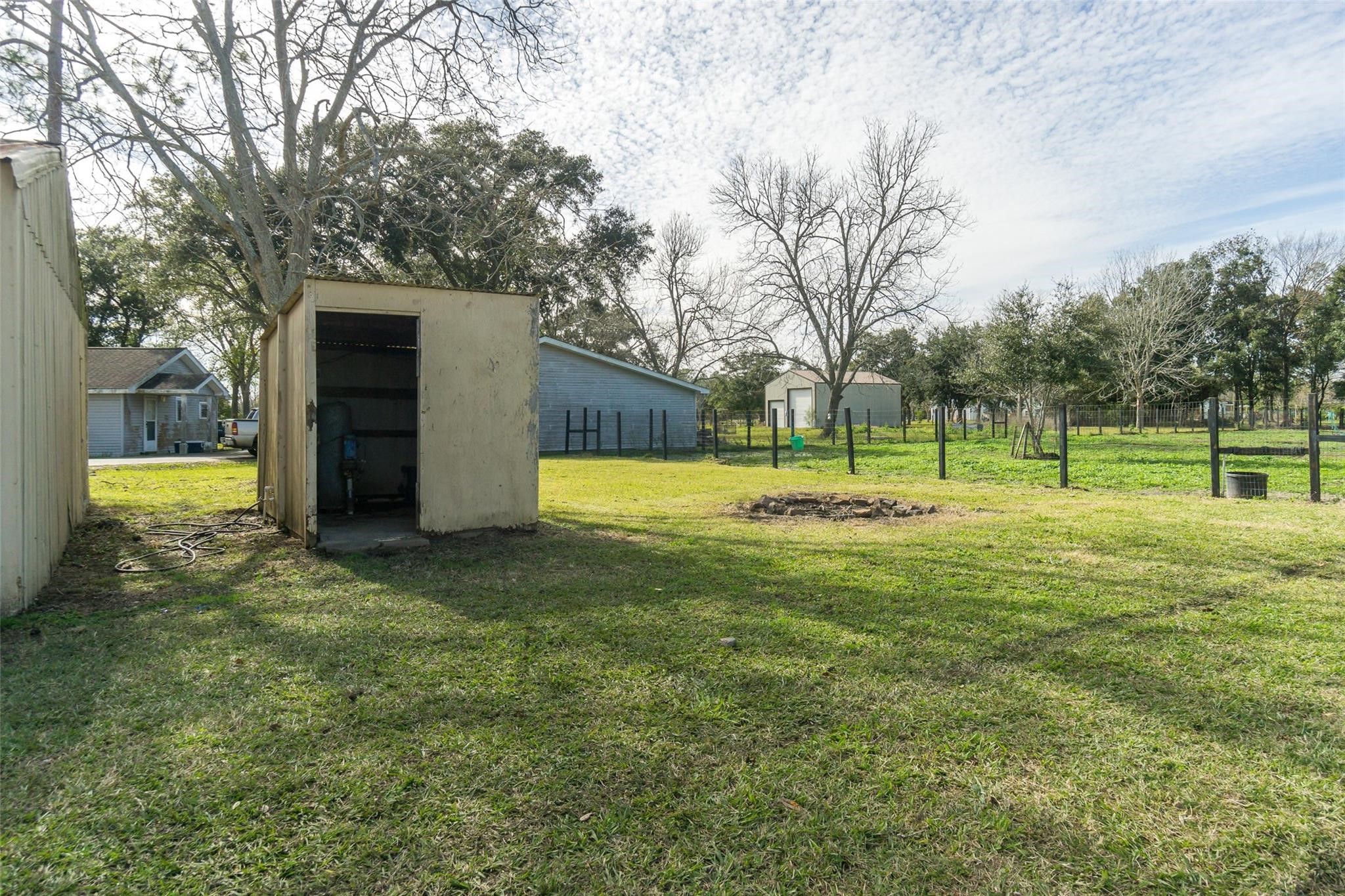 4604 South Tower Road Santa Fe, TX 77517 - Photo 24 of 28 a view of a big yard with a small yard and large trees