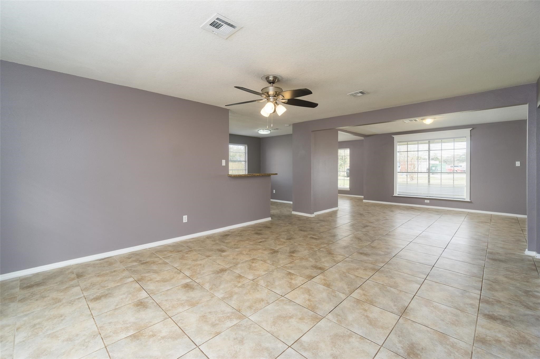 4604 South Tower Road Santa Fe, TX 77517 - Photo 6 of 28 a view of an empty room with window and chandelier fan