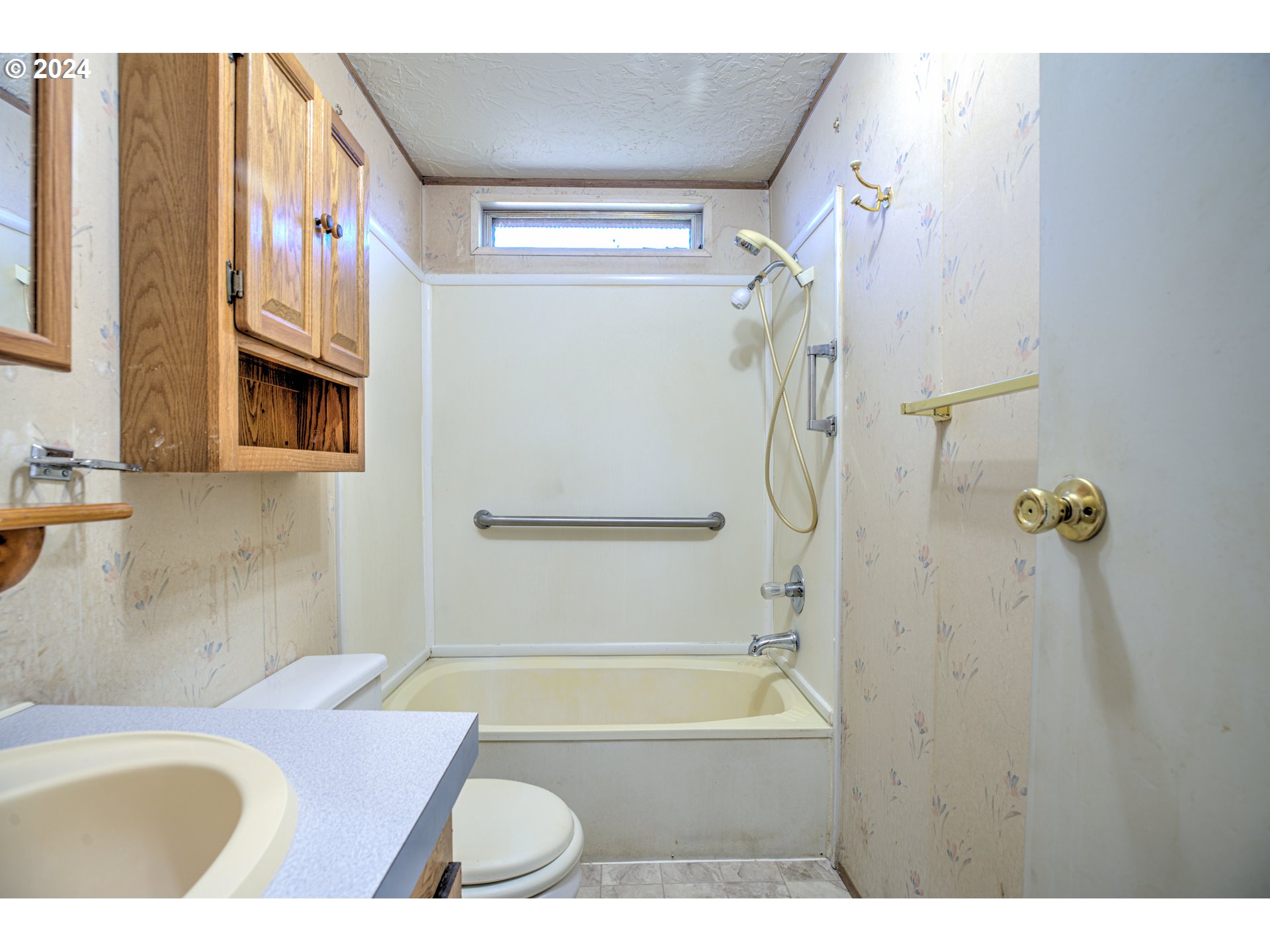 19605 River Road Gladstone, OR 97027 - Photo 19 of 21 a bathroom with a granite countertop bathtub shower sink vanity and a toilet