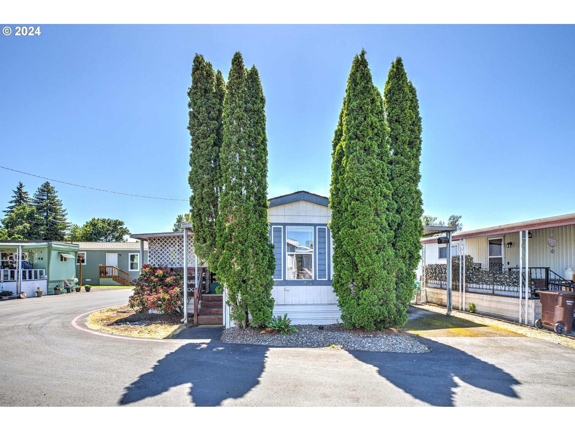 19605 River Road Gladstone, OR 97027 - Photo 2 of 21 a view of a yard and front view of a building