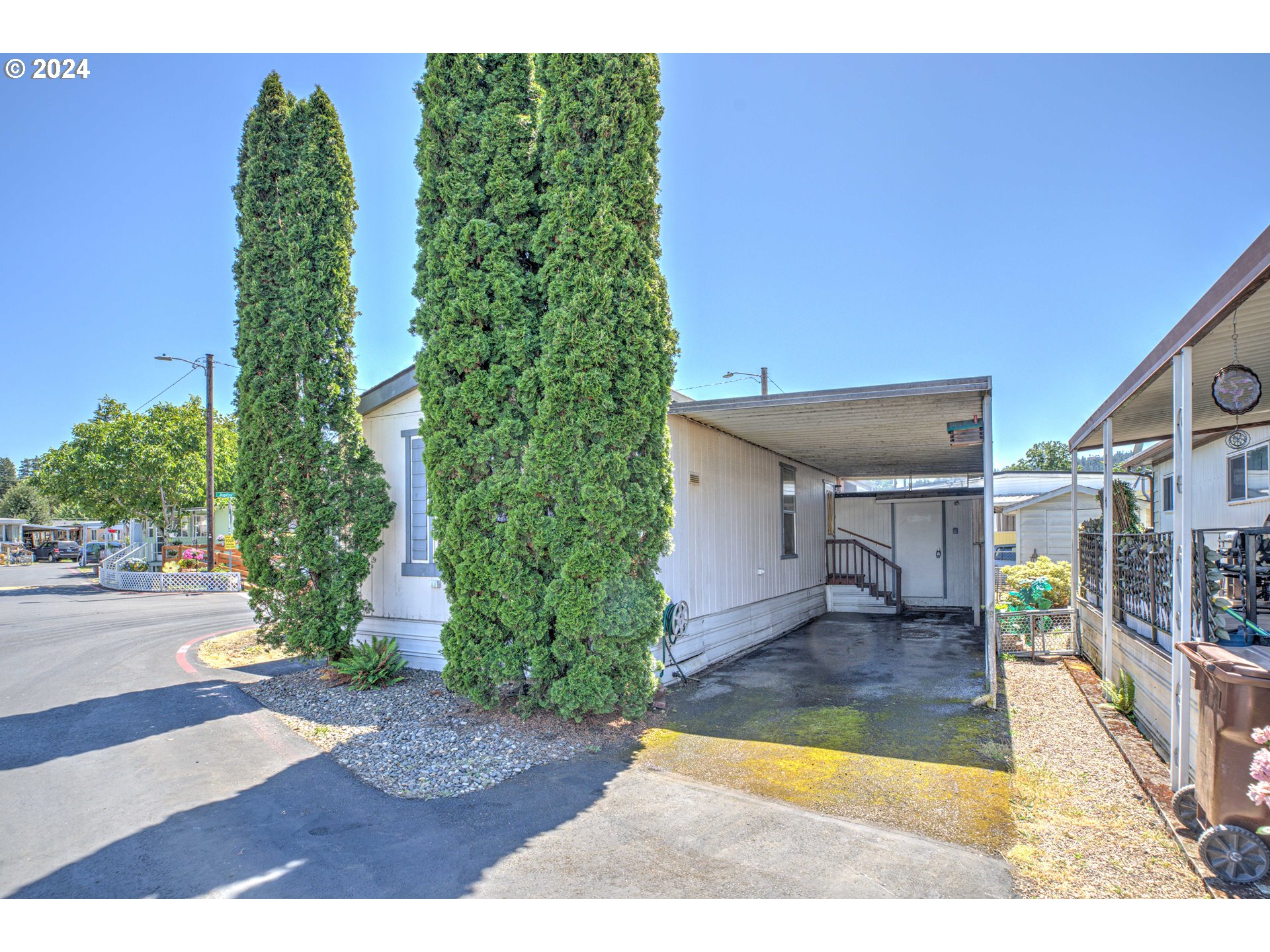 19605 River Road Gladstone, OR 97027 - Photo 3 of 21 a view of a porch and a yard