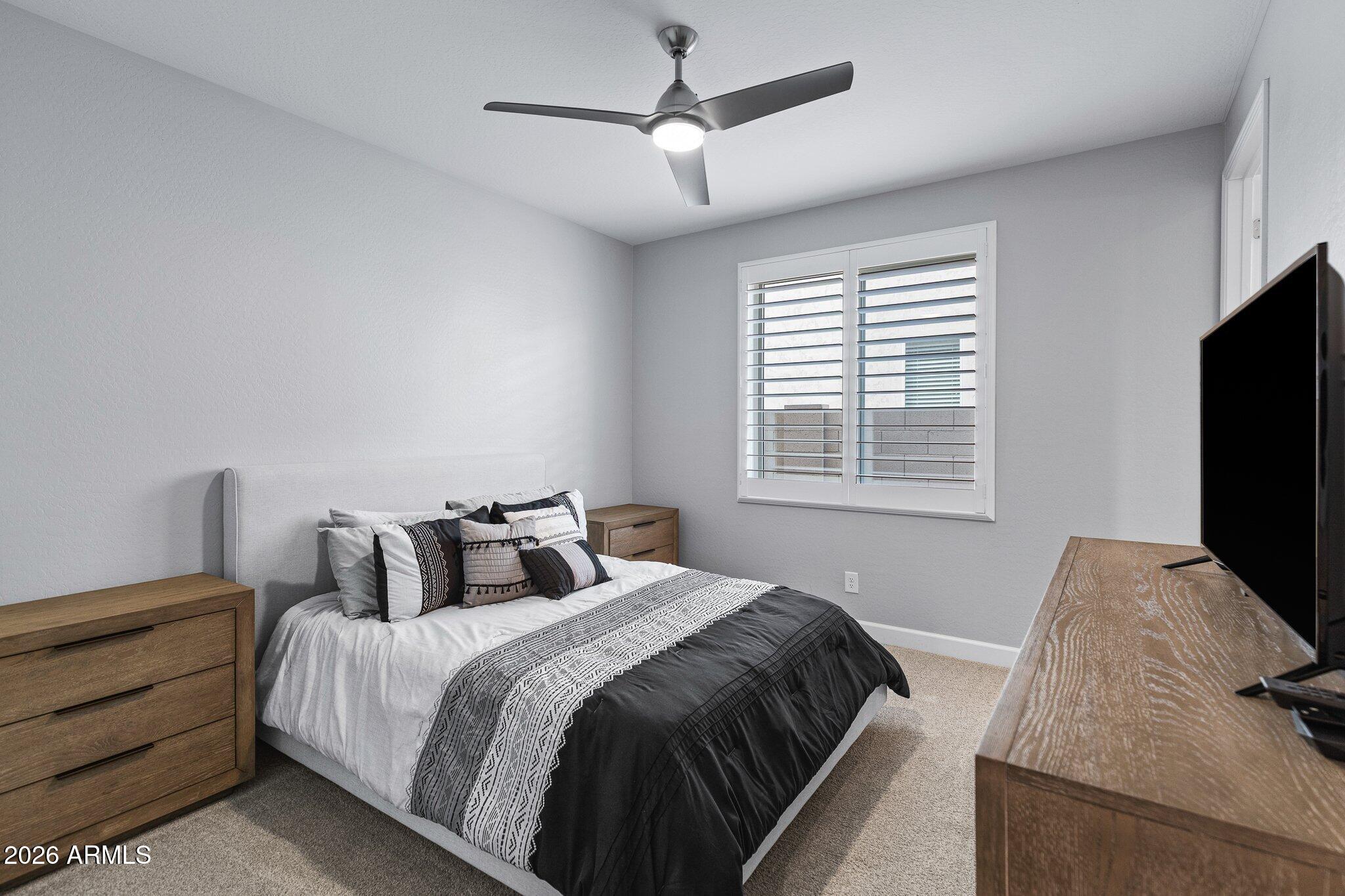16897 West Almeria Road Goodyear, AZ 85395 - Photo 21 of 51 Comfortable Ensuite Bedroom