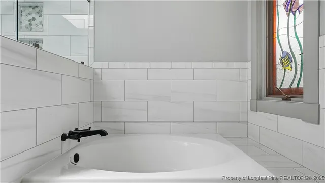 a bathroom with a bathtub