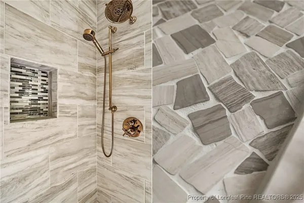 a bathroom with a bathtub and shower