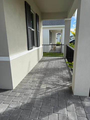 a view of hallway with wooden floor