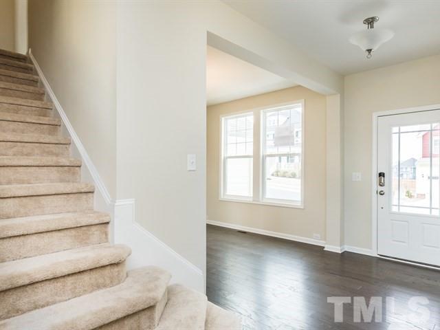 4138 Davis Meadow Street Raleigh, NC 27616 - Photo 3 of 25 a view of entryway and hall with wooden floor