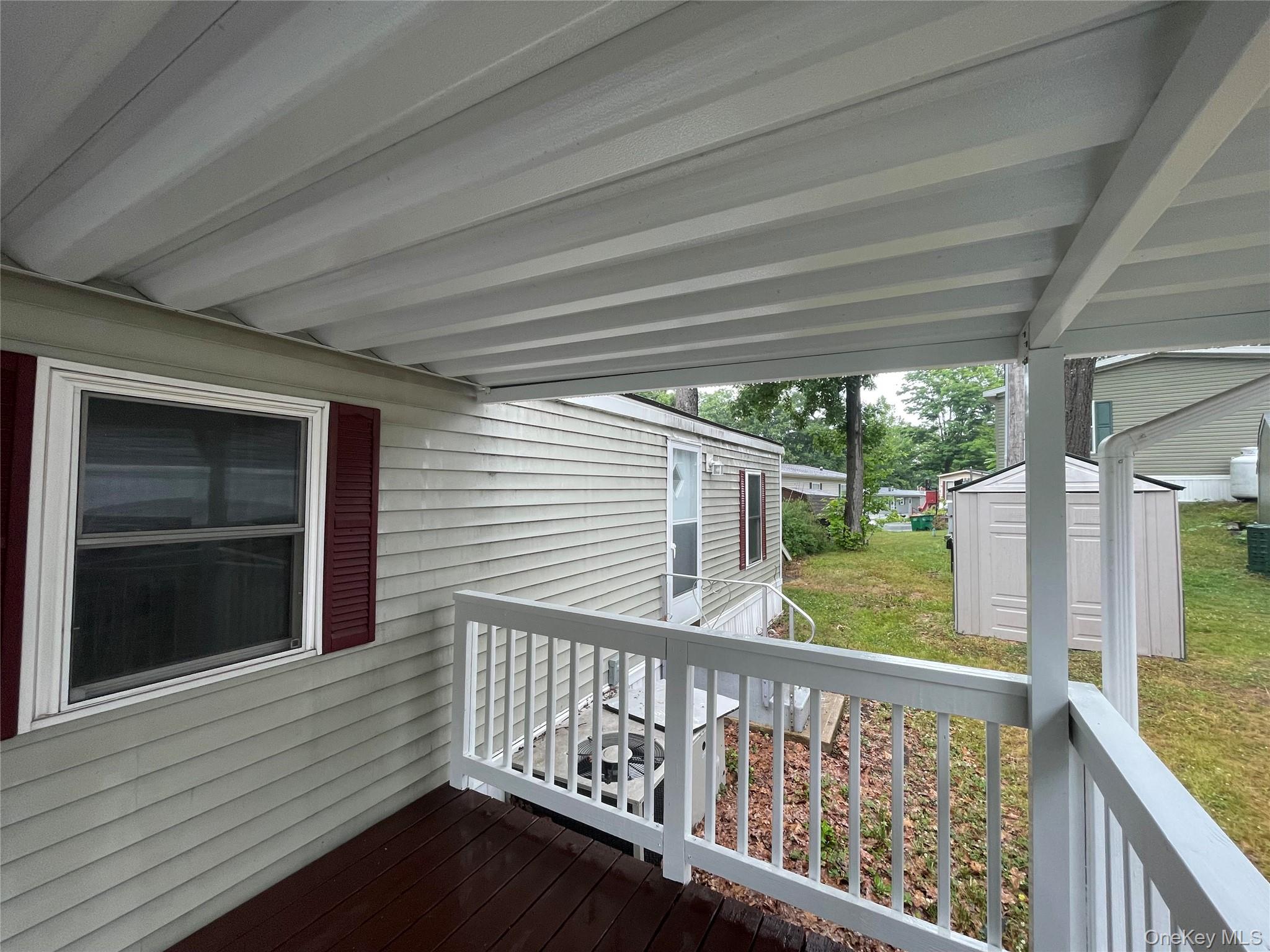 95 New Hackensack Road, Unit 45 Wappingers Falls, NY 12590 - Photo 17 of 17 Porch with Shed in Yard