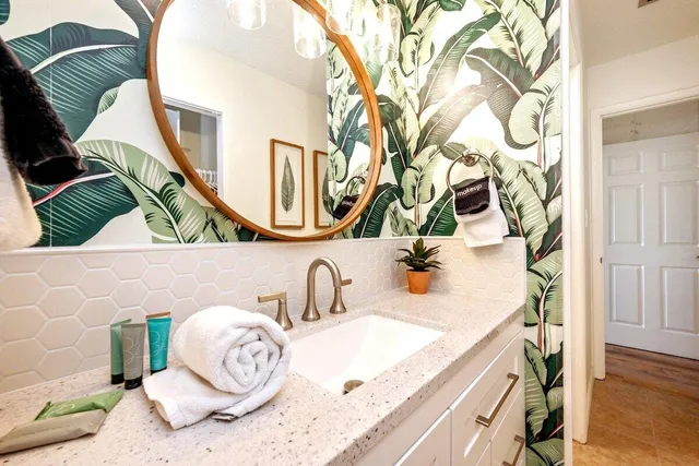 a bathroom with a sink and a mirror