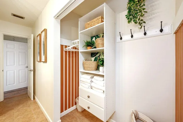 a view of bedroom with furniture and wooden floor