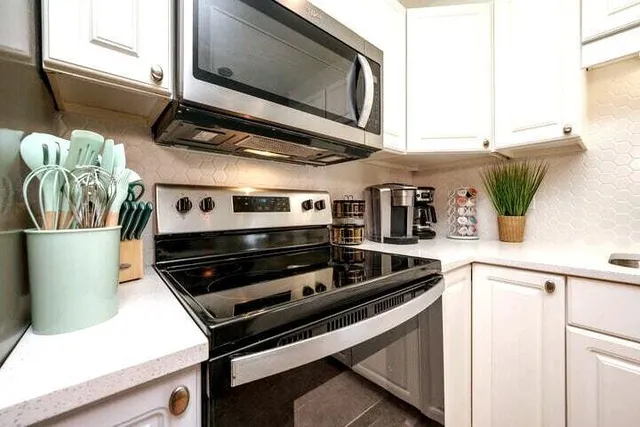 a kitchen with a stove and a microwave