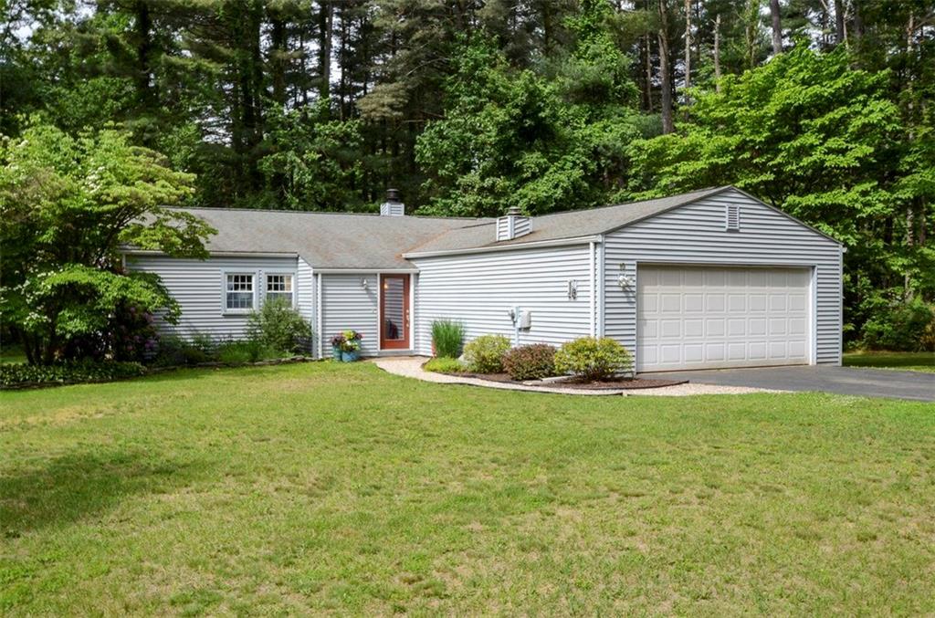19 Basile Road Granby, CT 06035 - Photo 1 of 1 a front view of a house with a yard and garage