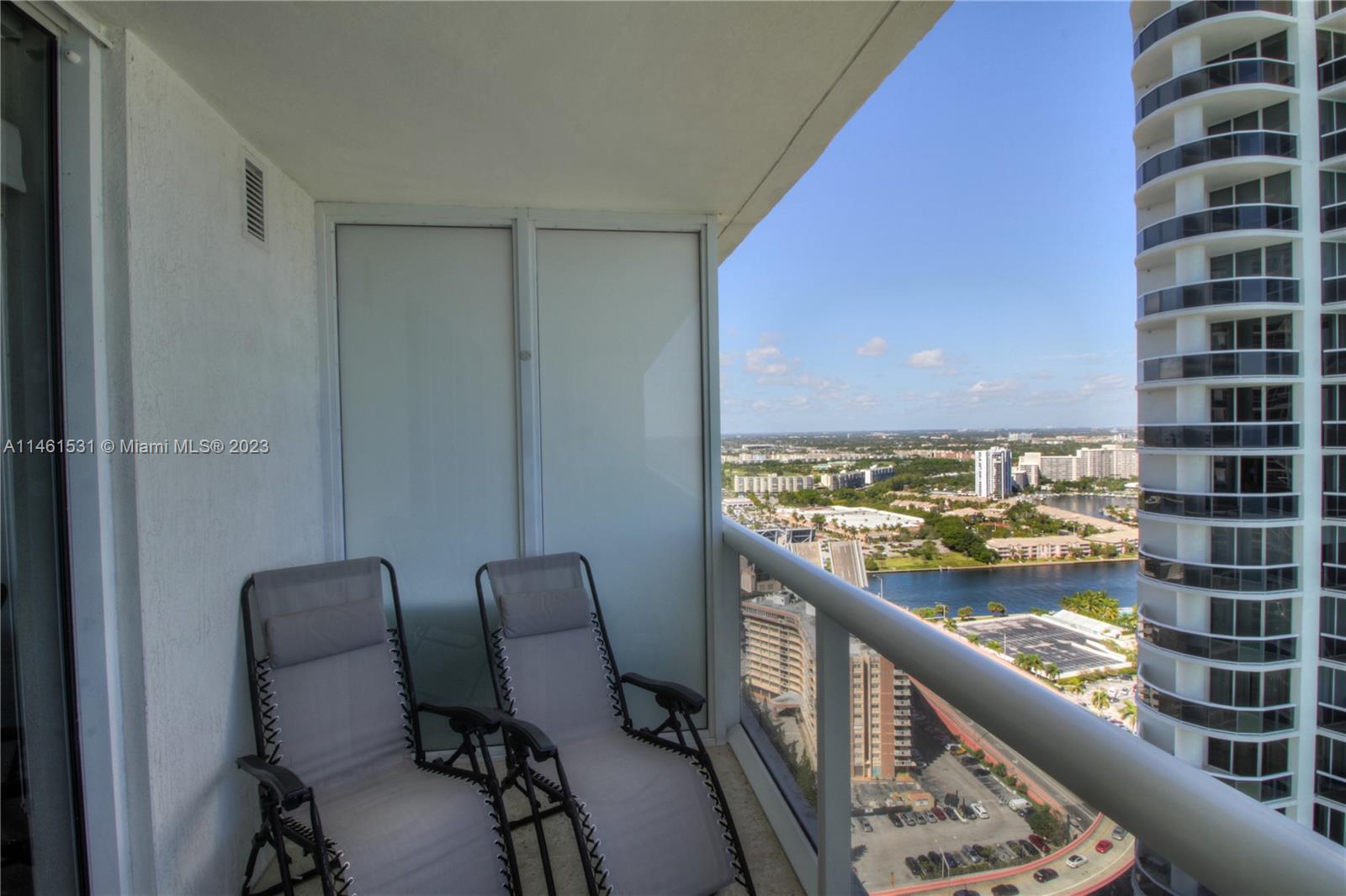 9195 Collins Avenue, Unit 613 Surfside, FL 33154 - Photo 13 of 13 a view of a balcony with chair and table