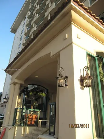 a living room with a flat screen tv and gym equipment