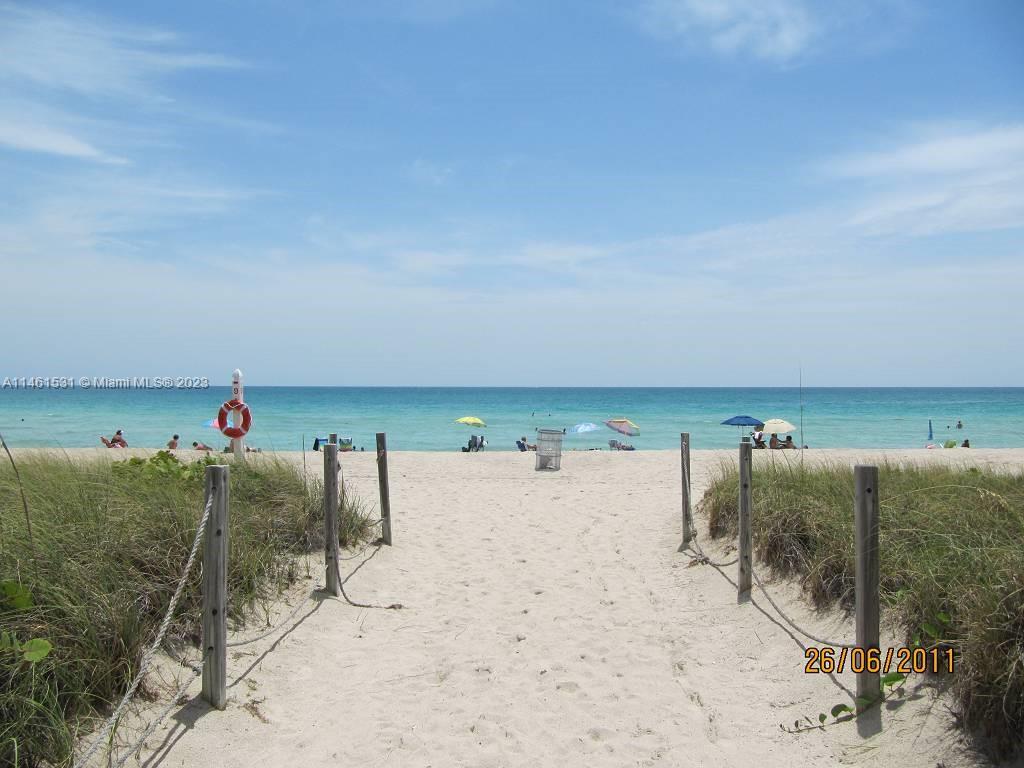 9195 Collins Avenue, Unit 613 Surfside, FL 33154 - Photo 6 of 13 a view of ocean with beach