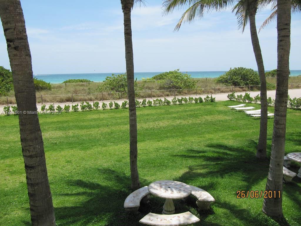 9195 Collins Avenue, Unit 613 Surfside, FL 33154 - Photo 8 of 13 a view of a garden with a ocean view