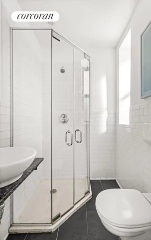 a view of a big room with closet and windows