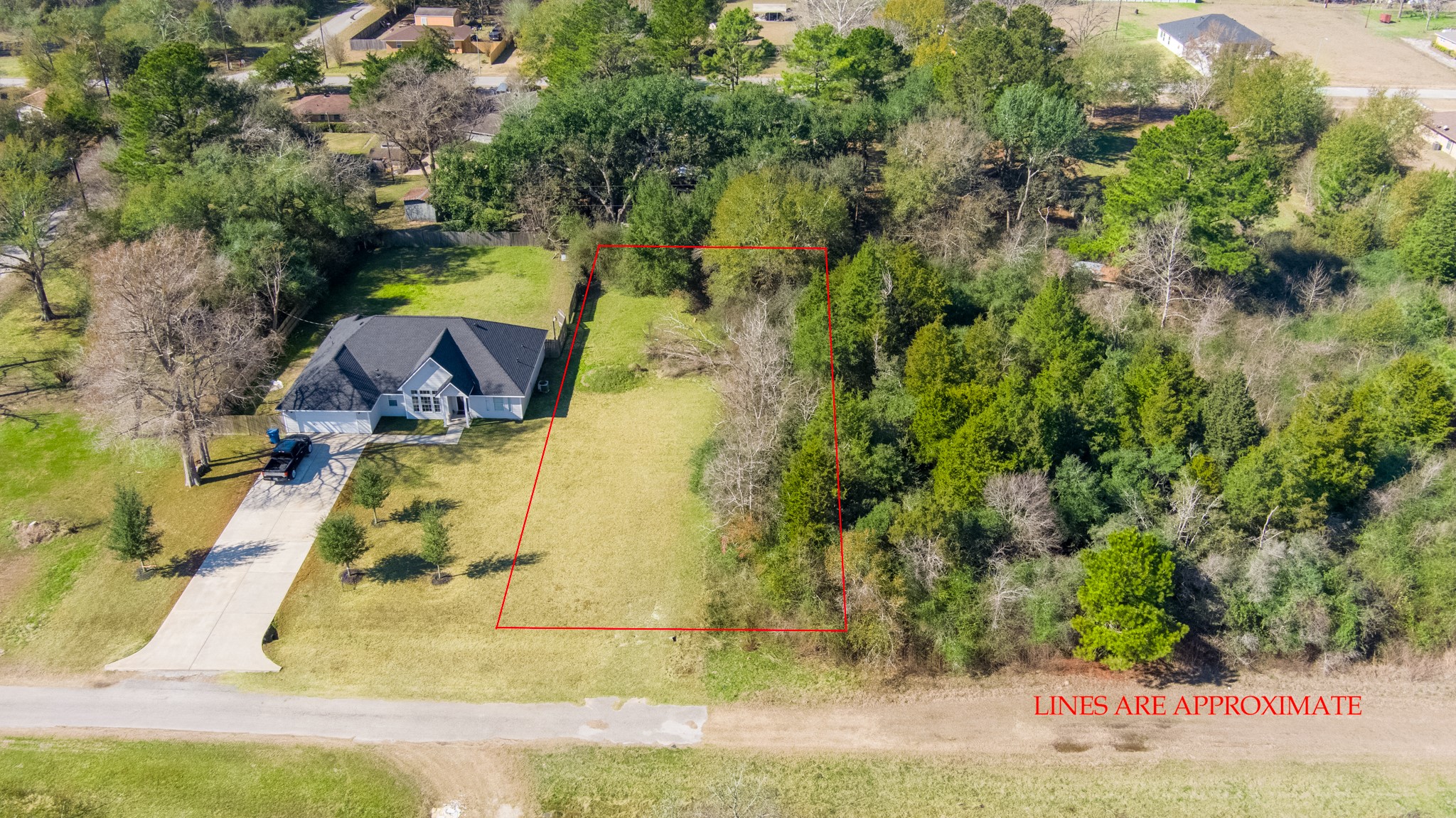0 Pearl Street Waller, TX 77484 - Photo 2 of 8 an aerial view of residential houses with outdoor space