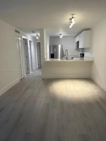 a view of kitchen and windows