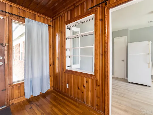 a view of front door with wooden floor