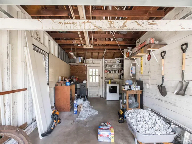 a view of an house with backyard and tree