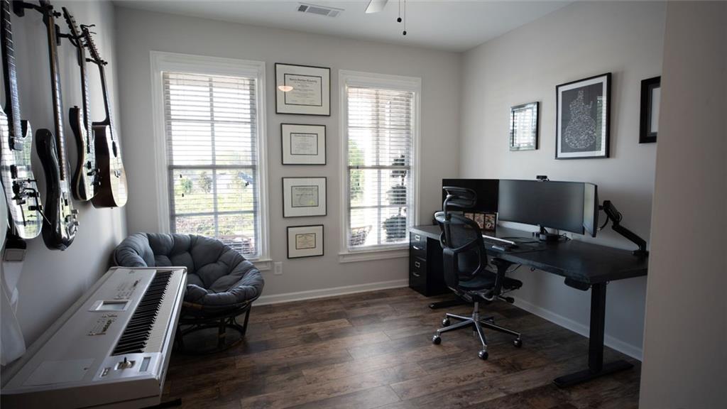 6165 Namon Wallace Road Cumming, GA 30028 - Photo 17 of 30 a view of a livingroom with workspace and a window