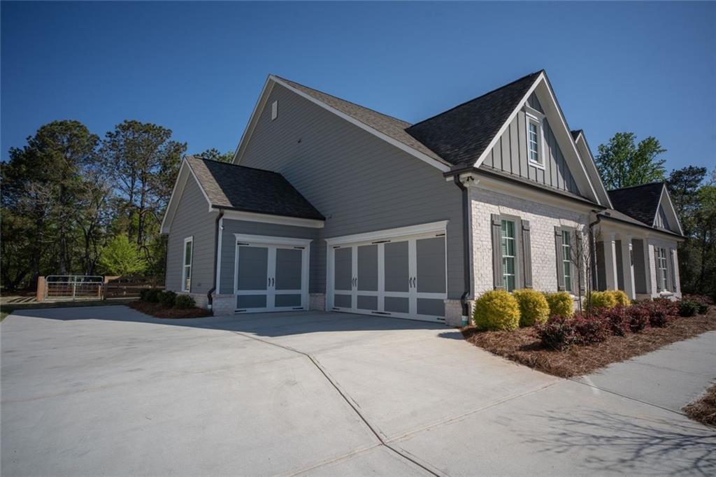 6165 Namon Wallace Road Cumming, GA 30028 - Photo 3 of 30 a front view of a house with a yard