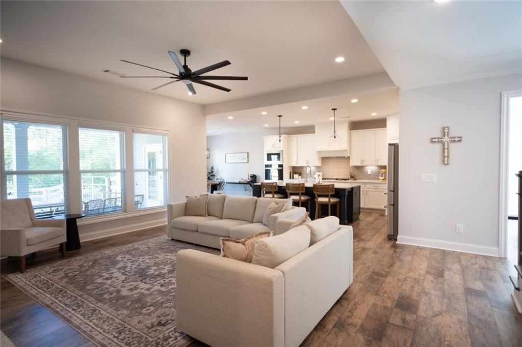 6165 Namon Wallace Road Cumming, GA 30028 - Photo 7 of 30 a living room with furniture and a large window