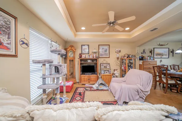 a view of walk in closet with clothes