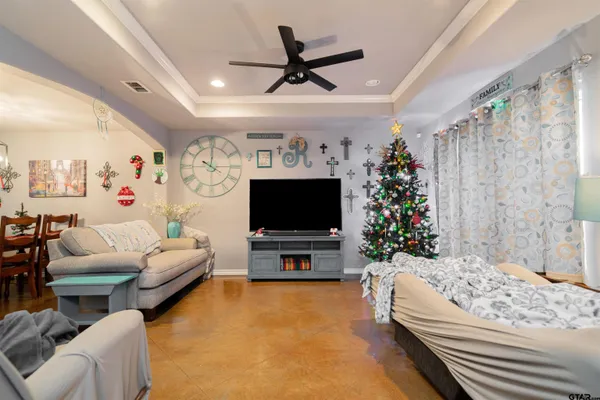 a living room with furniture and a flat screen tv