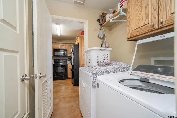 a view of a dining room with furniture and a chandelier