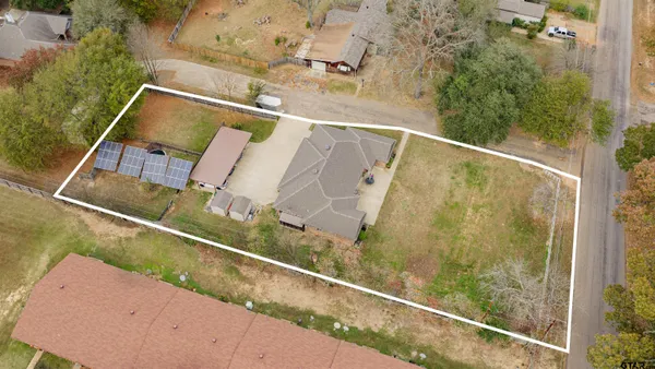an aerial view of house with swimming pool