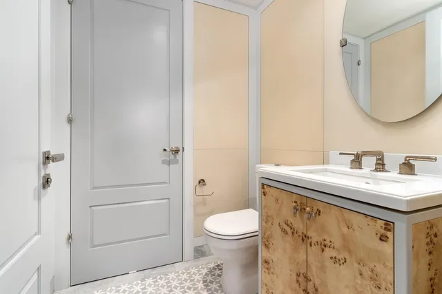 a bathroom with a sink toilet and vanity
