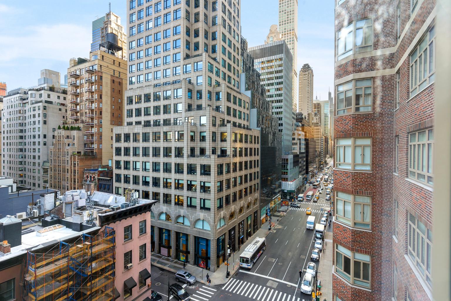 21 East 61st Street, Unit 9C Manhattan, NY 10065 - Photo 12 of 19 a view of a city with tall buildings