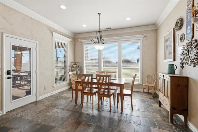 a view of a dining room with furniture window and outside view