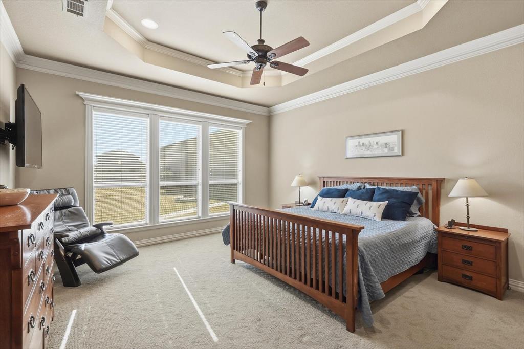 209 Lonesome Prairie Trail Haslet, TX 76052 - Photo 14 of 40 a bed room with a bed and a large window