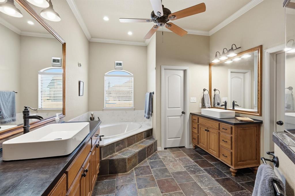 209 Lonesome Prairie Trail Haslet, TX 76052 - Photo 15 of 40 a bathroom with a double vanity sink mirror and bathtub