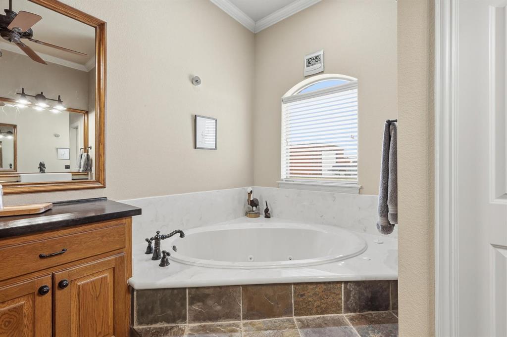 209 Lonesome Prairie Trail Haslet, TX 76052 - Photo 16 of 40 a bathroom with a sink and a mirror