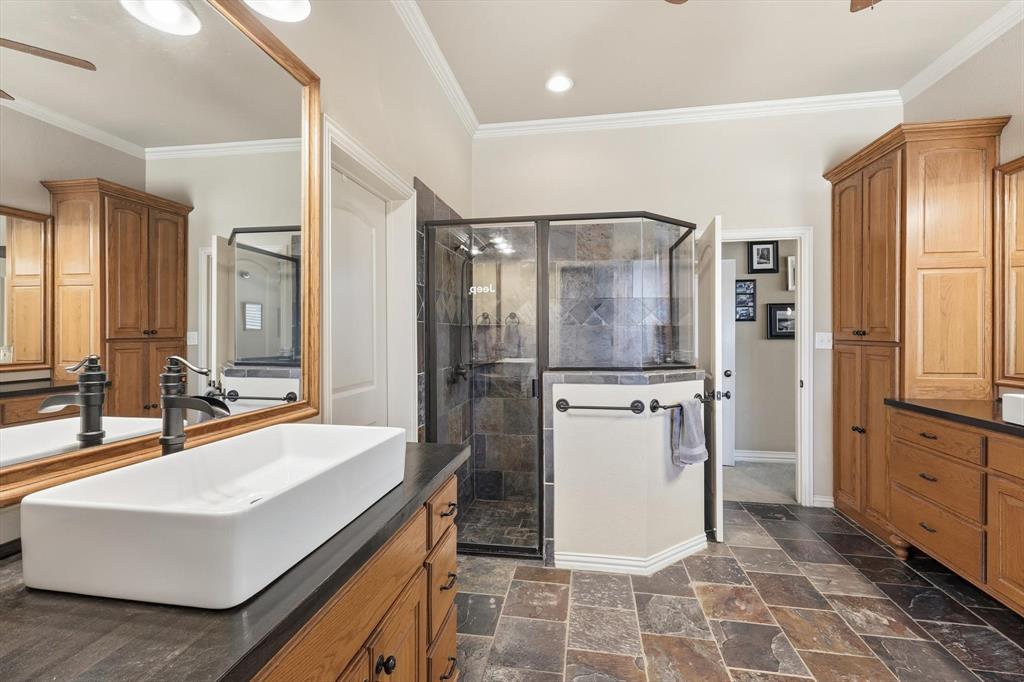 209 Lonesome Prairie Trail Haslet, TX 76052 - Photo 17 of 40 a bathroom with a sink toilet and shower