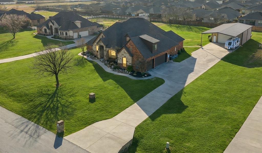 209 Lonesome Prairie Trail Haslet, TX 76052 - Photo 2 of 40 a view of a house with a yard