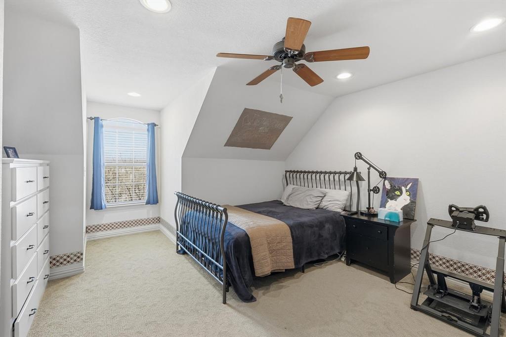 209 Lonesome Prairie Trail Haslet, TX 76052 - Photo 27 of 40 a bedroom with a bed and a dresser