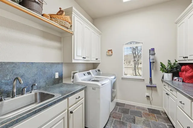 a kitchen that has a sink and a window