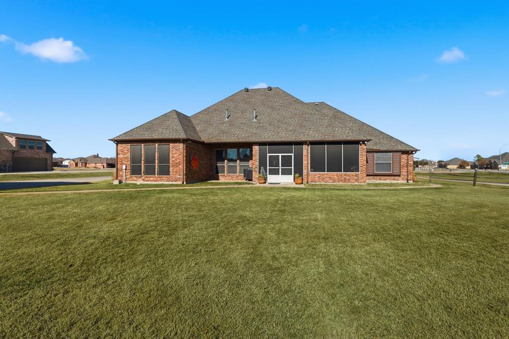 209 Lonesome Prairie Trail Haslet, TX 76052 - Photo 31 of 40 a front view of a house with a garden and porch