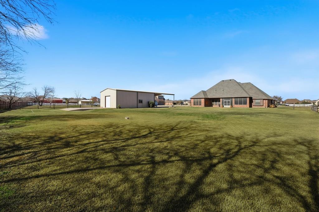 209 Lonesome Prairie Trail Haslet, TX 76052 - Photo 32 of 40 a view of a house with yard and outdoor space