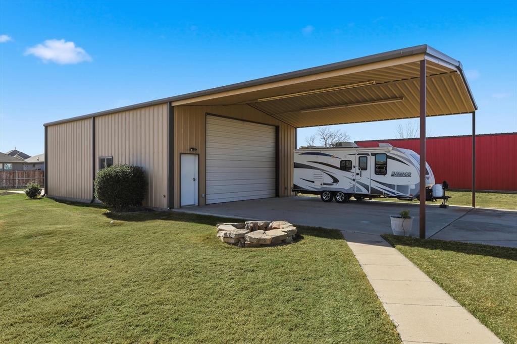 209 Lonesome Prairie Trail Haslet, TX 76052 - Photo 34 of 40 a house view with a backyard space