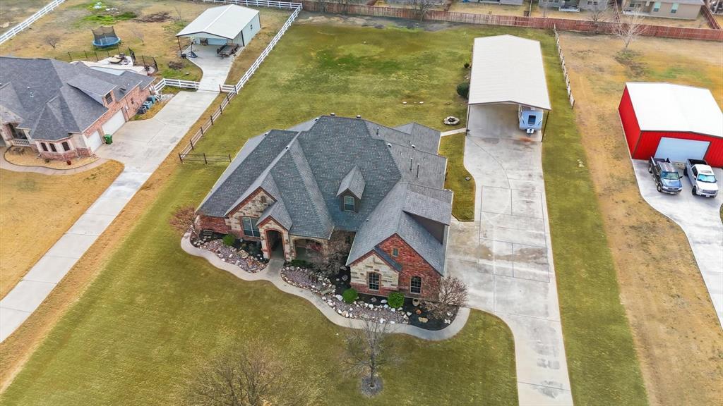209 Lonesome Prairie Trail Haslet, TX 76052 - Photo 40 of 40 an aerial view of a house with swimming pool